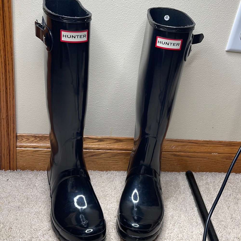 Hunter rain boots over calf.